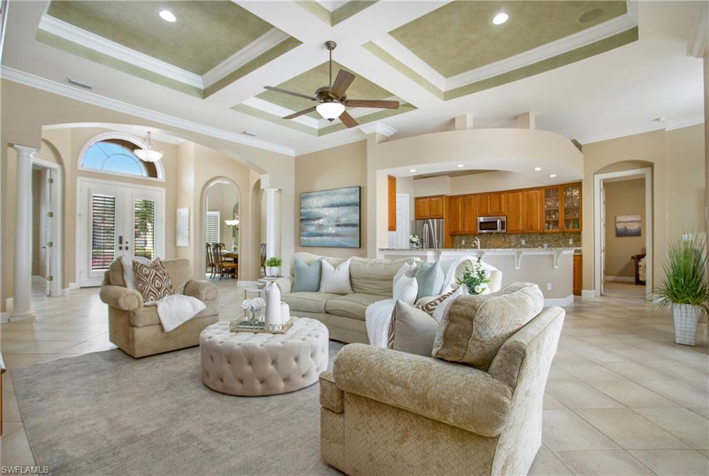 9807 Nickel Ridge Circle Naples, FL 34120 - Photo 21 of 50 a living room with furniture and a large window