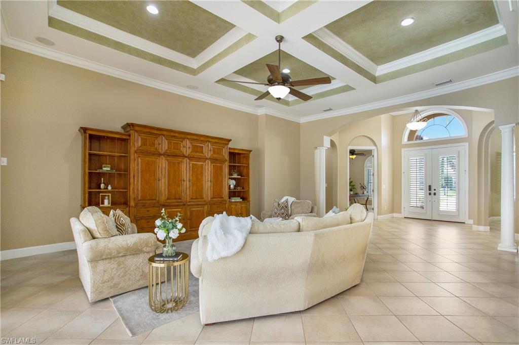 9807 Nickel Ridge Circle Naples, FL 34120 - Photo 22 of 50 a living room with furniture and a large window