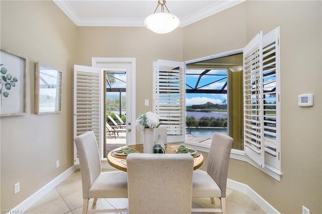 a kitchen with stainless steel appliances granite countertop a sink a stove and a microwave