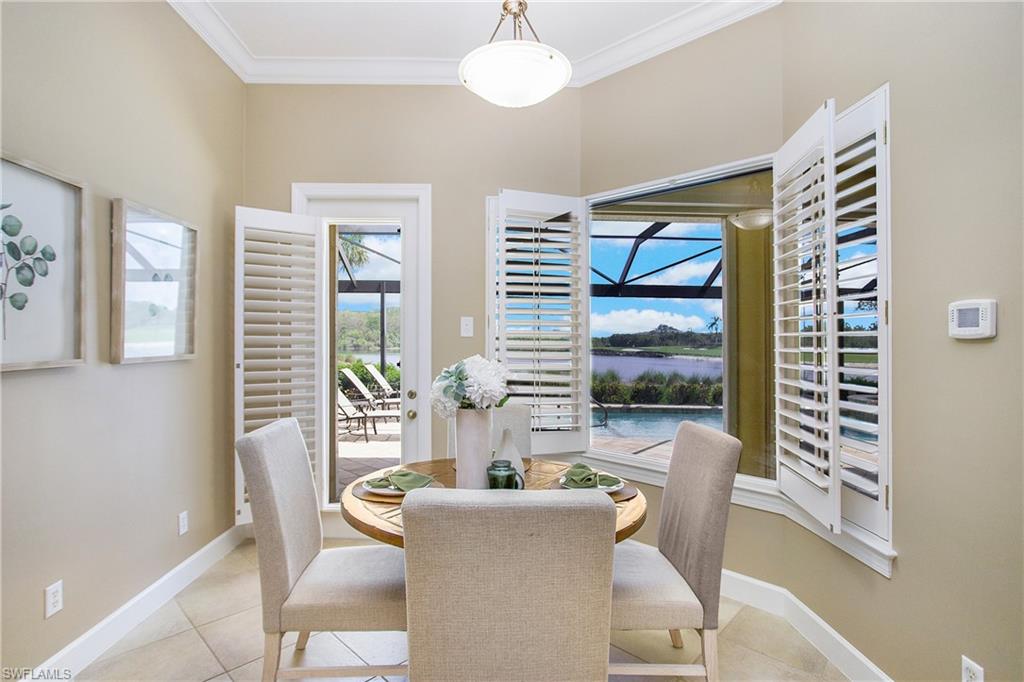 9807 Nickel Ridge Circle Naples, FL 34120 - Photo 26 of 50 a living room with furniture and a window