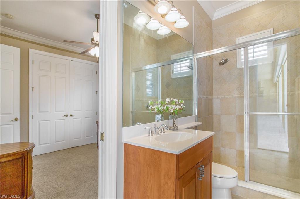 9807 Nickel Ridge Circle Naples, FL 34120 - Photo 31 of 50 a bathroom with a sink vanity mirror and toilet