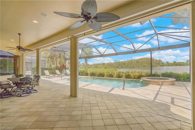 a swimming pool with yard in front of it