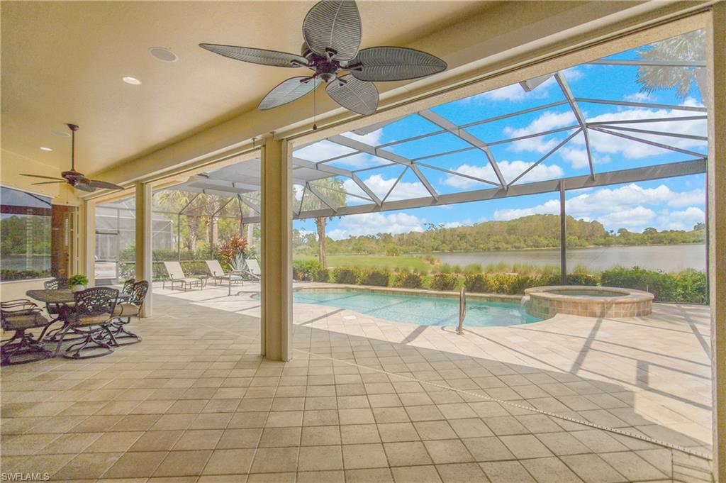 9807 Nickel Ridge Circle Naples, FL 34120 - Photo 38 of 50 a view of an ocean and a floor to ceiling window