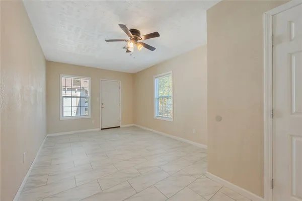 a view of an empty room with a window