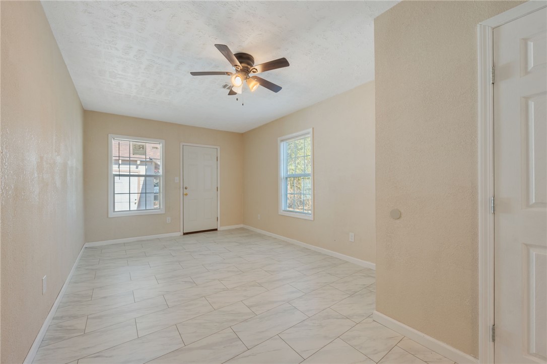 401 East 3rd Street Hearne, TX 77859 - Photo 15 of 25 a view of an empty room with a window
