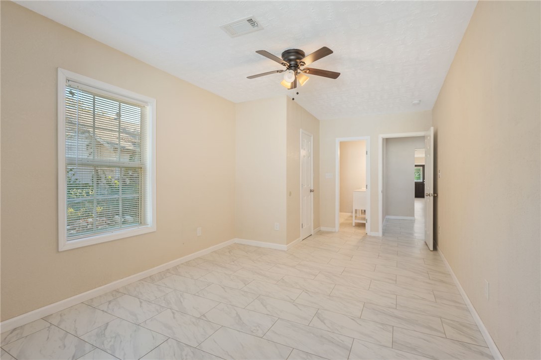 401 East 3rd Street Hearne, TX 77859 - Photo 16 of 25 a view of an empty room with a window
