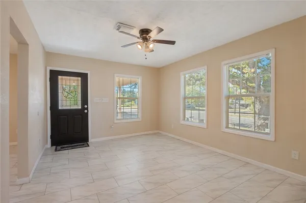 a view of an empty room with a window