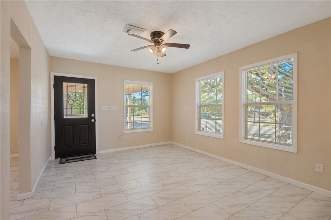 401 East 3rd Street Hearne, TX 77859 - Photo 2 of 25 a view of an empty room with a window