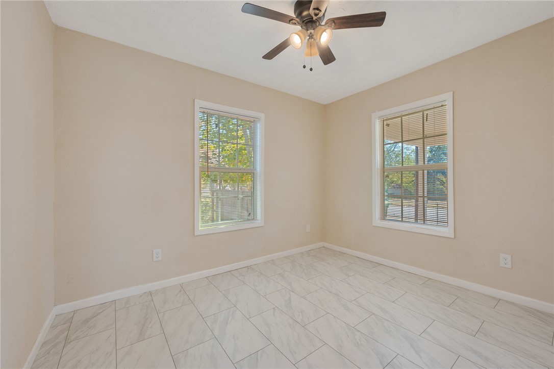 401 East 3rd Street Hearne, TX 77859 - Photo 5 of 25 a view of an empty room with a window