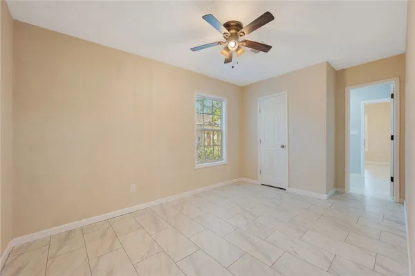 a view of an empty room with a window