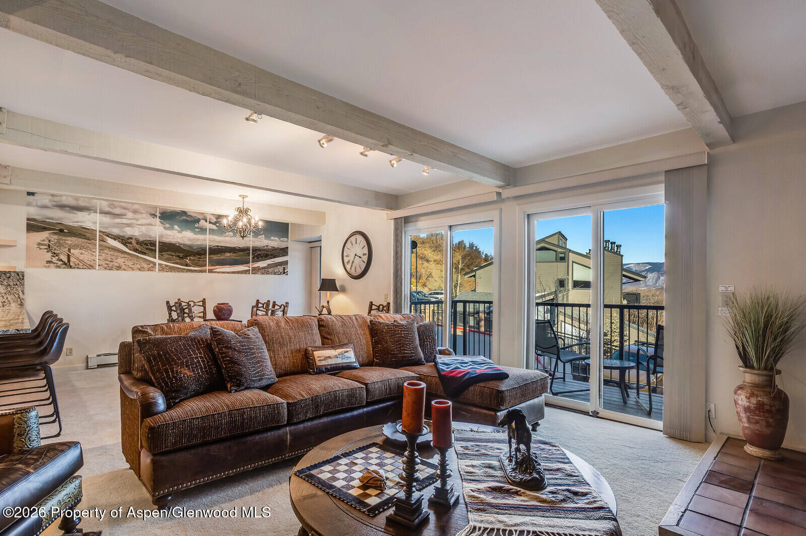 55 Upper Woodbridge Road, Unit E2 Snowmass Village, CO 81615 - Photo 18 of 41 a living room with furniture and wooden floor