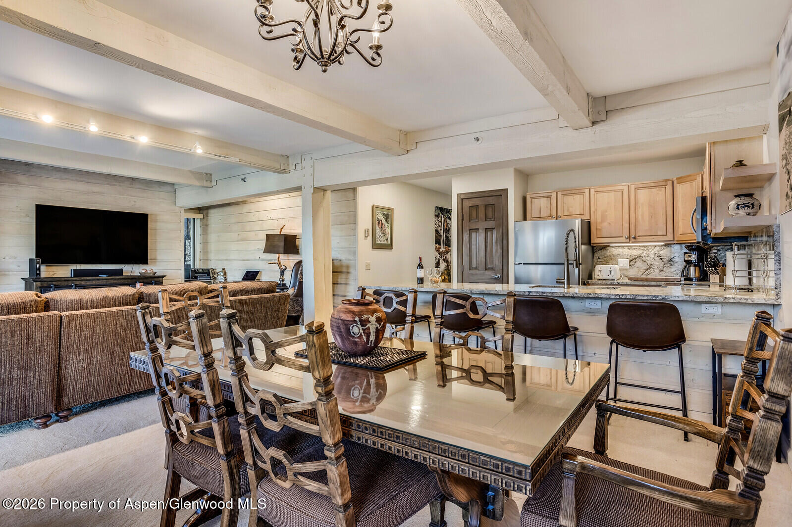 55 Upper Woodbridge Road, Unit E2 Snowmass Village, CO 81615 - Photo 24 of 41 a view of a dining room with furniture