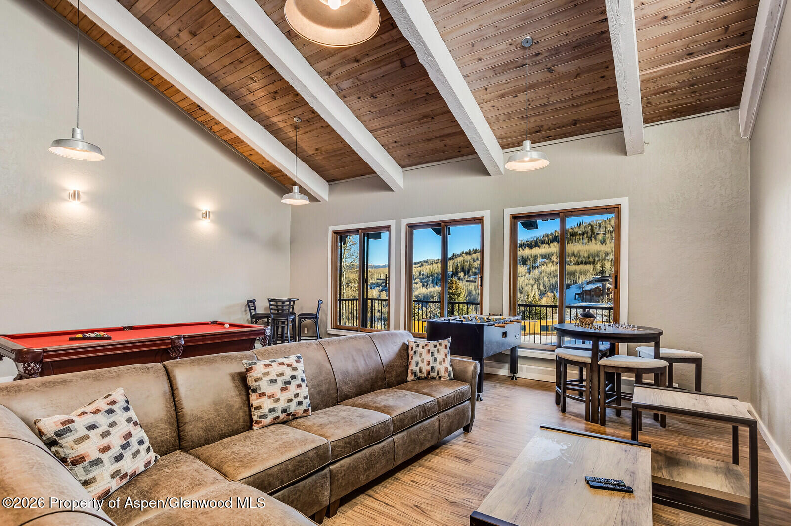 55 Upper Woodbridge Road, Unit E2 Snowmass Village, CO 81615 - Photo 34 of 41 a living room with furniture and a large window