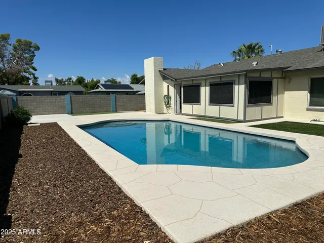 a view of outdoor space yard and swimming pool
