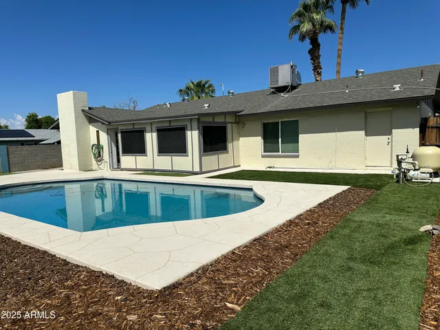 a view of a house with a swimming pool