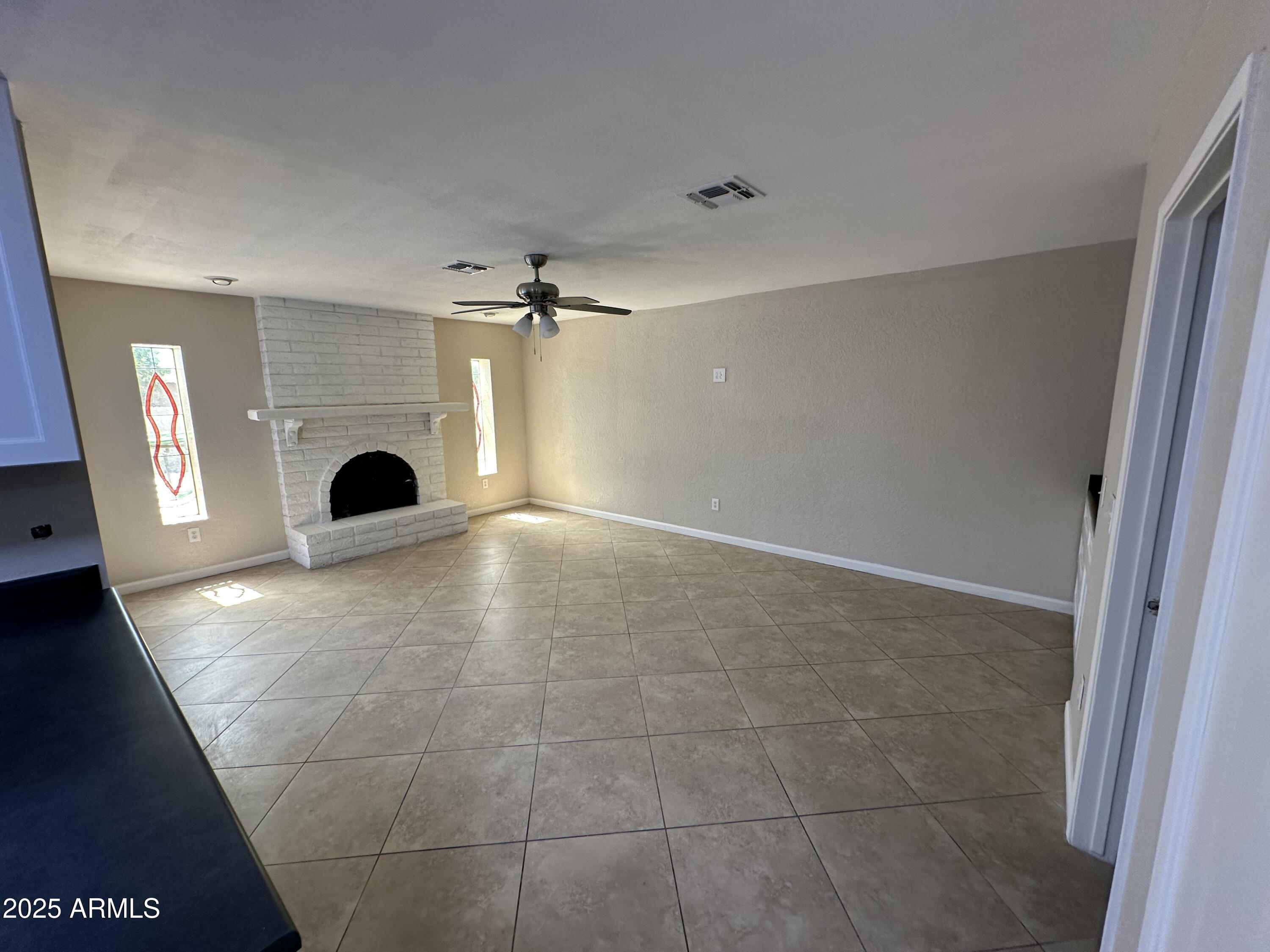 4639 West Ruth Avenue Glendale, AZ 85302 - Photo 7 of 23 a view of a livingroom with a staircase
