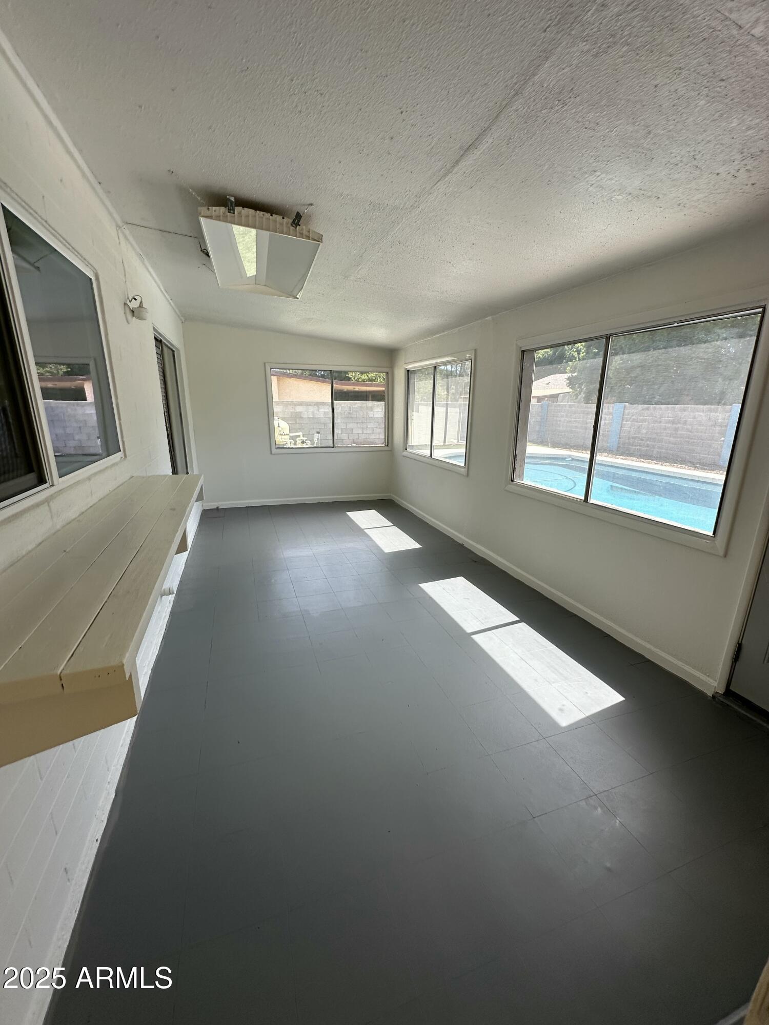 4639 West Ruth Avenue Glendale, AZ 85302 - Photo 8 of 23 a view of an empty room with window and stairs