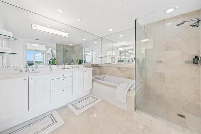 a large bathroom with a glass shower door