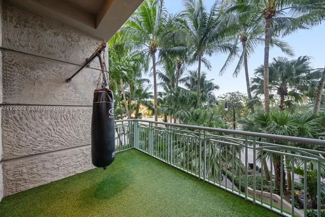 a balcony with trees in front of it