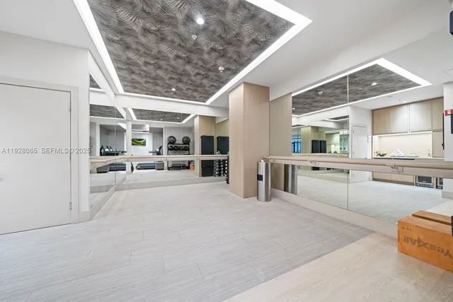 a large white building with glass windows