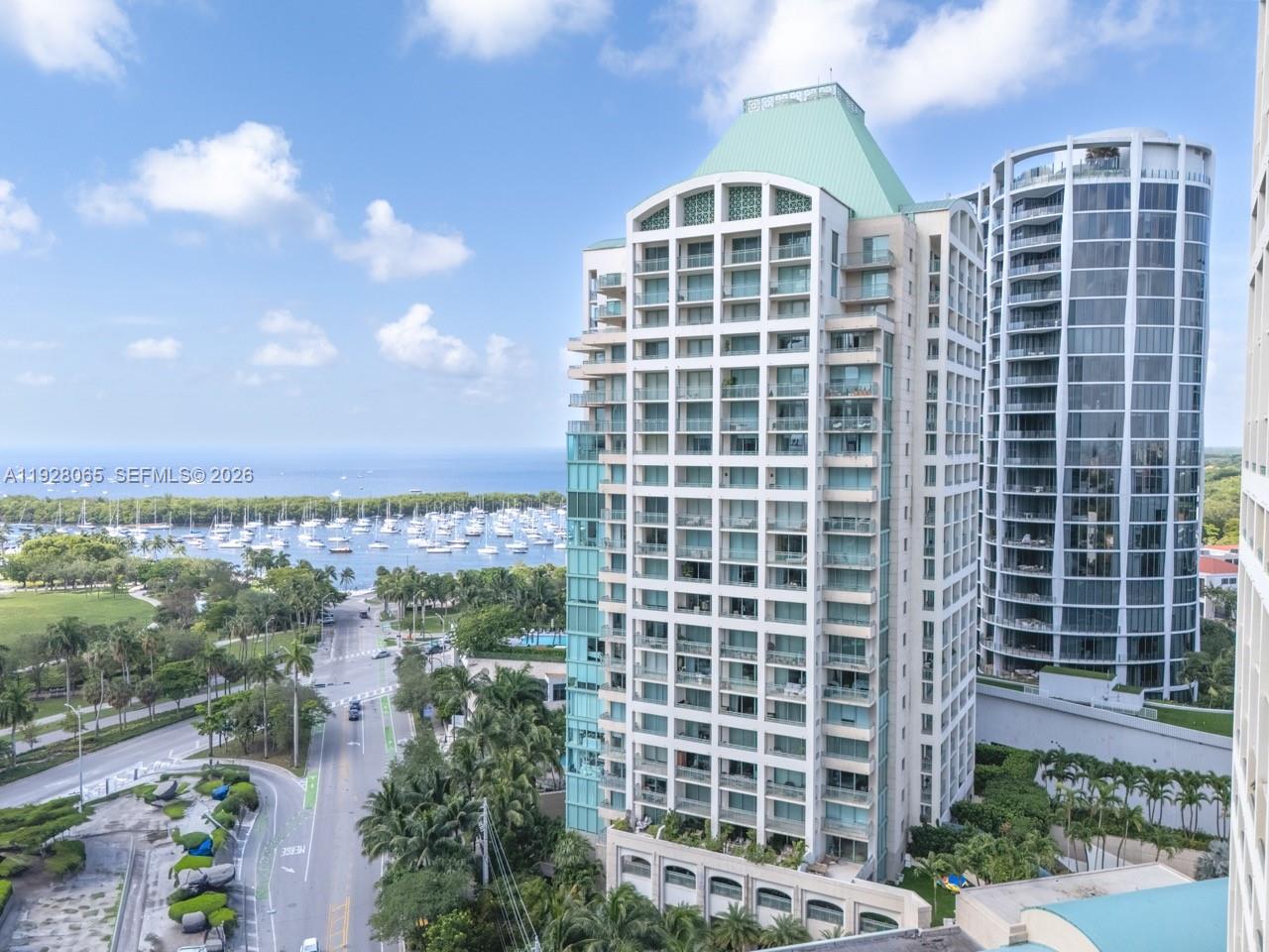 3400 Southwest 27th Avenue, Unit 1805 Miami, FL 33133 - Photo 25 of 28 a view of a building with a yard