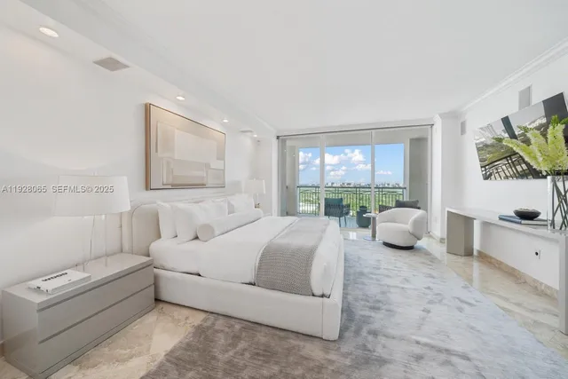 a spacious bedroom with a bed and a large window