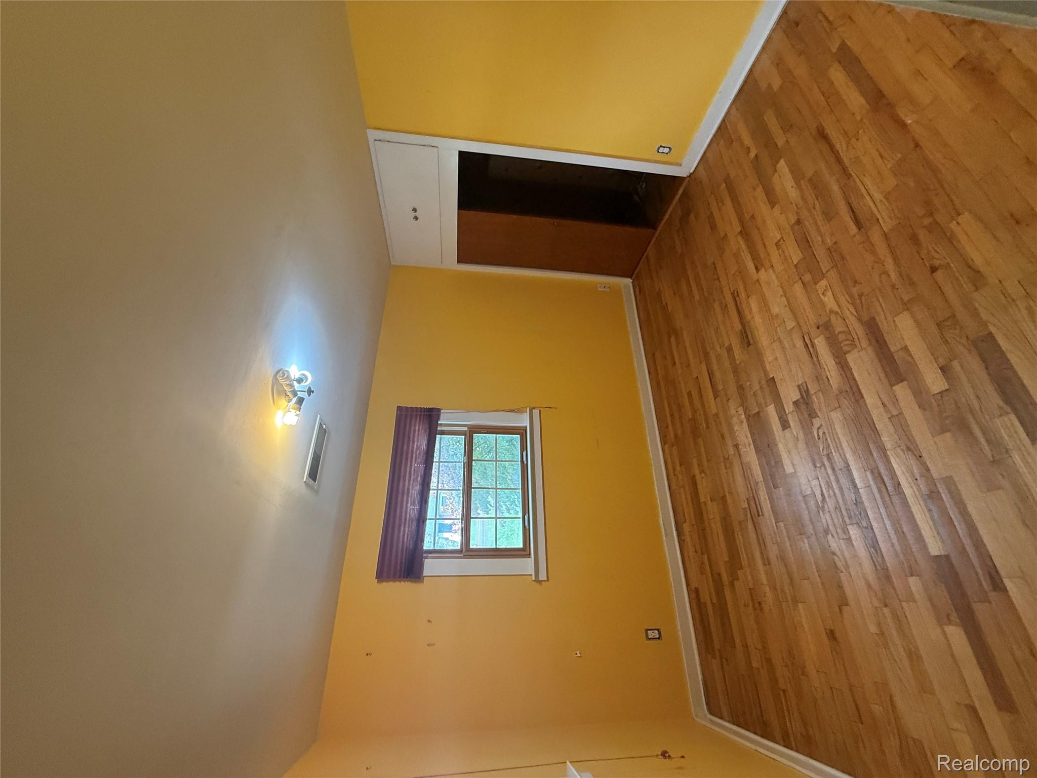 3176 East Fisher Road Bay City, MI 48706 - Photo 11 of 25 Unfurnished room featuring light wood-style floors