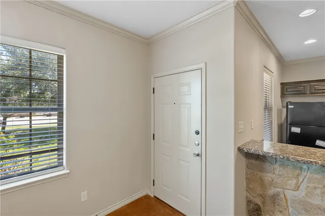 a view of an empty room and window