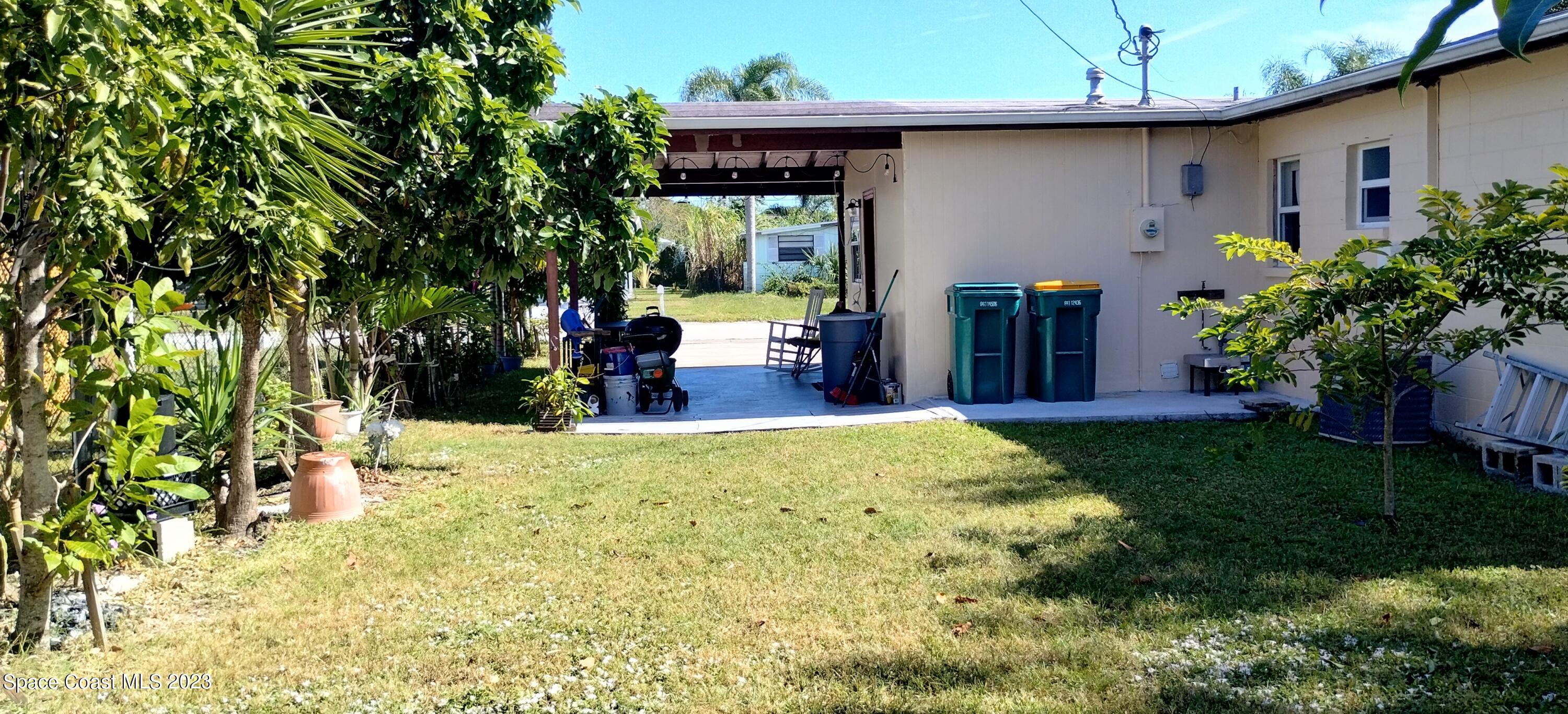 4100 Edwards Street Melbourne, FL 32901 - Photo 19 of 22 a view of a porch with furniture and garden