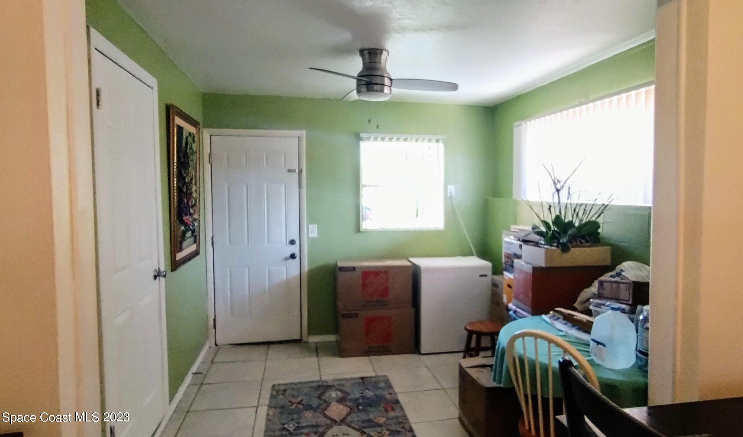 4100 Edwards Street Melbourne, FL 32901 - Photo 6 of 22 a living room with furniture and a window