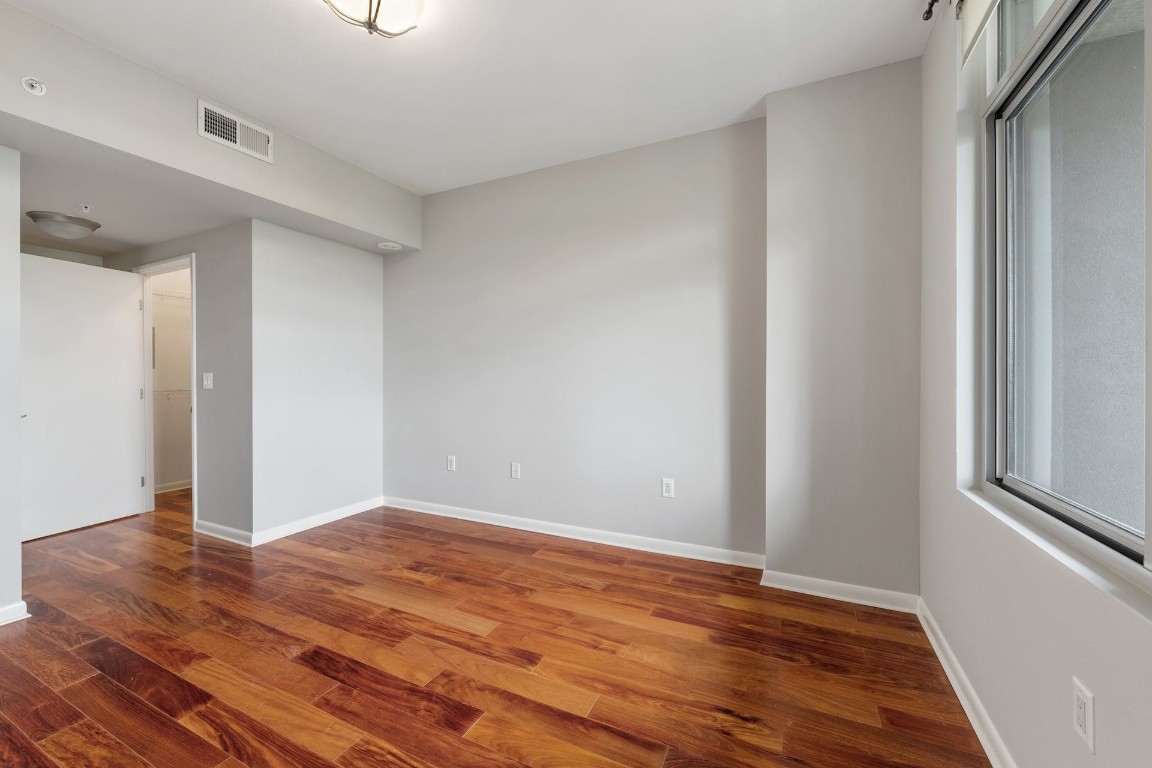 54 Rainey Street, Unit 810 Austin, TX 78701 - Photo 23 of 35 a view of room with wooden floor