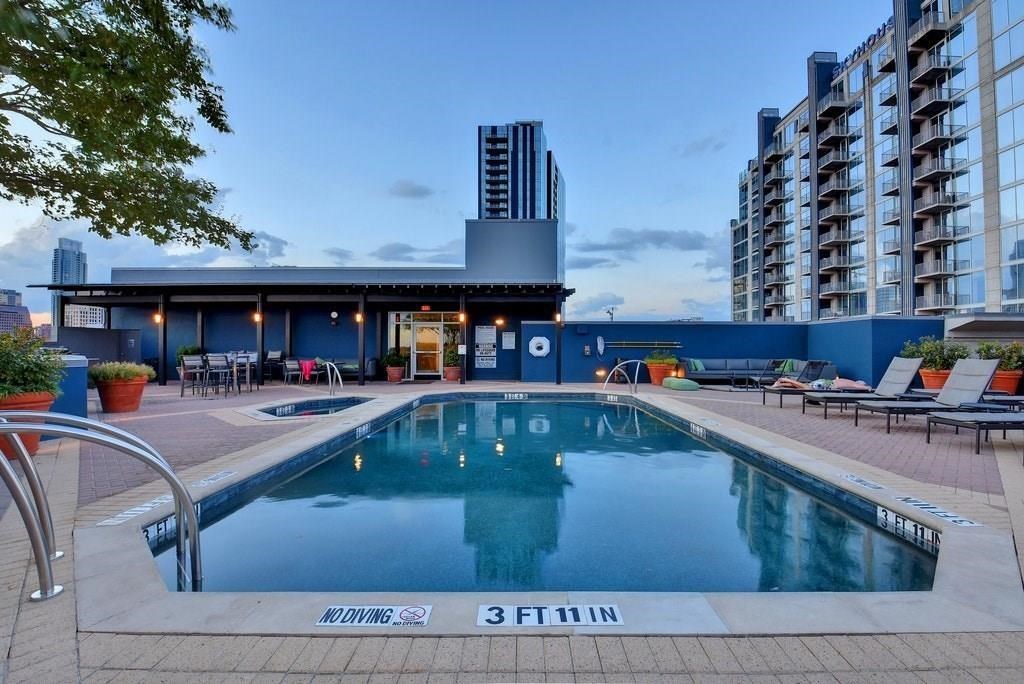 54 Rainey Street, Unit 810 Austin, TX 78701 - Photo 28 of 35 a view of swimming pool with outdoor seating