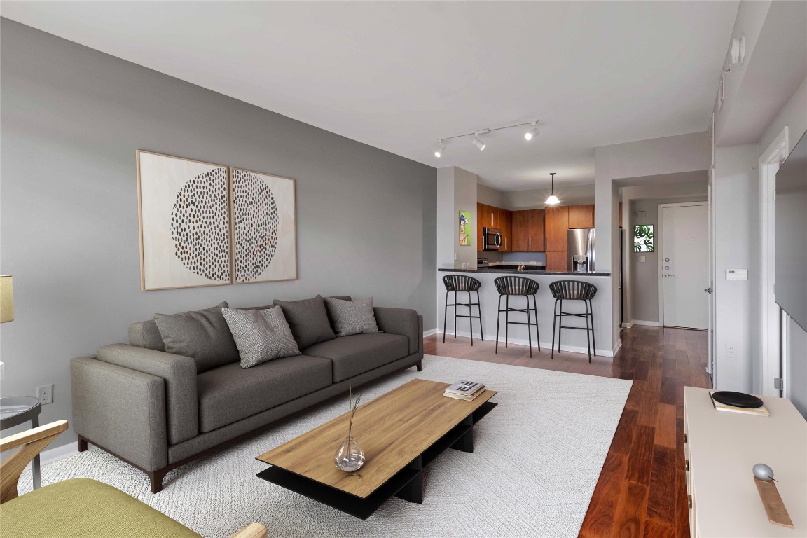 54 Rainey Street, Unit 810 Austin, TX 78701 - Photo 5 of 35 a living room with furniture and a table