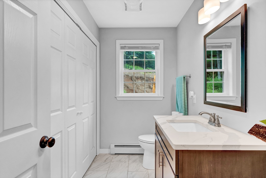 170 Shea Road West Brookfield, MA 01585 - Photo 21 of 30 a bathroom with a sink a toilet and a window