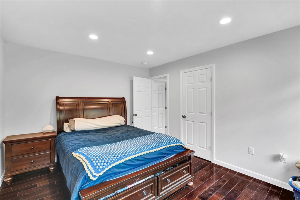 170 Shea Road West Brookfield, MA 01585 - Photo 24 of 30 a bedroom with a bed and wooden floor