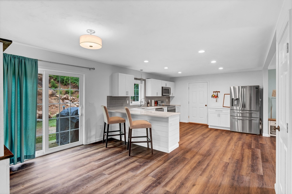 170 Shea Road West Brookfield, MA 01585 - Photo 28 of 30 a view of kitchen with cabinets and wooden floor