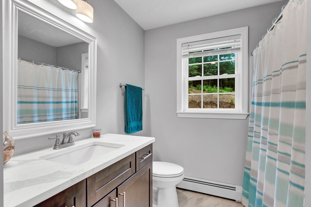 170 Shea Road West Brookfield, MA 01585 - Photo 29 of 30 a bathroom with a sink vanity toilet and shower