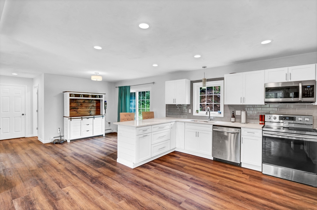 170 Shea Road West Brookfield, MA 01585 - Photo 5 of 30 a kitchen with stainless steel appliances granite countertop a stove and white cabinets