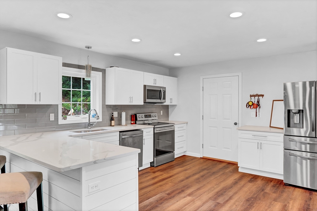 170 Shea Road West Brookfield, MA 01585 - Photo 7 of 30 a kitchen with white cabinets and stainless steel appliances