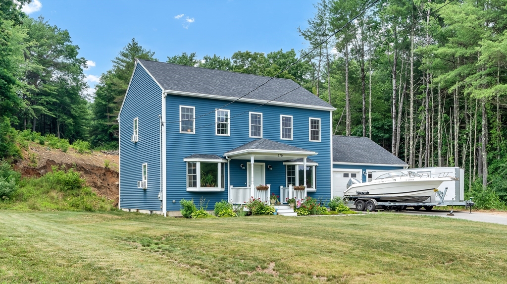 170 Shea Road West Brookfield, MA 01585 - Photo 10 of 30 a front view of a house with a garden and trees