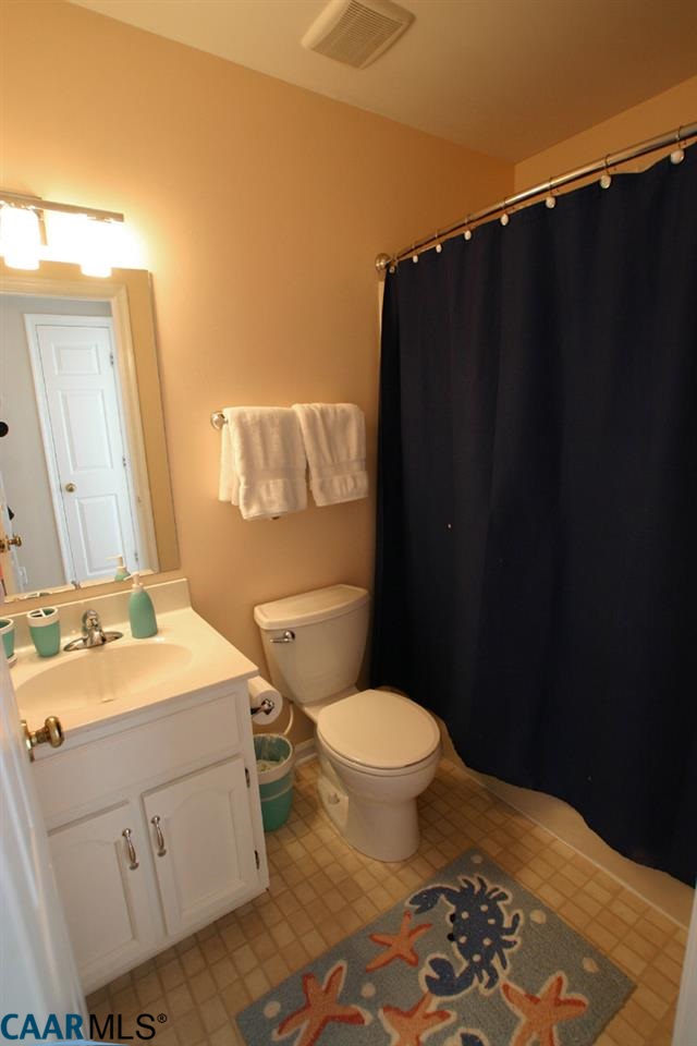 803 Harris Road Charlottesville, VA 22902 - Photo 15 of 15 a bathroom with a sink toilet and shower