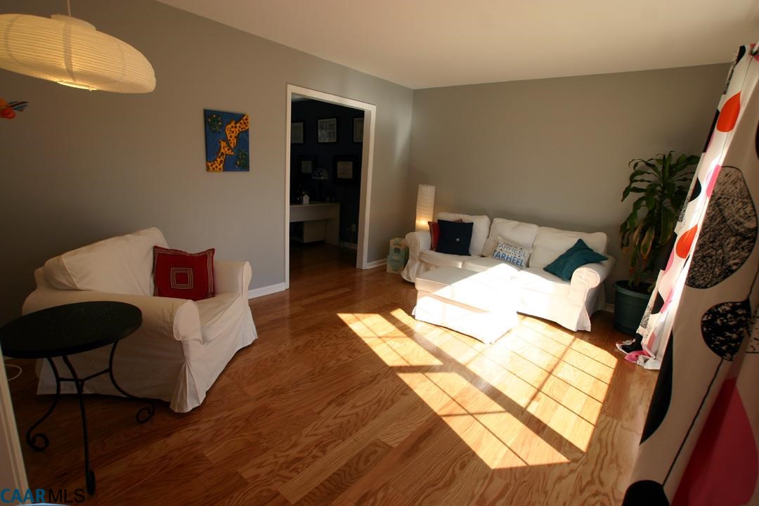 803 Harris Road Charlottesville, VA 22902 - Photo 2 of 15 a bedroom with a bed and a couch