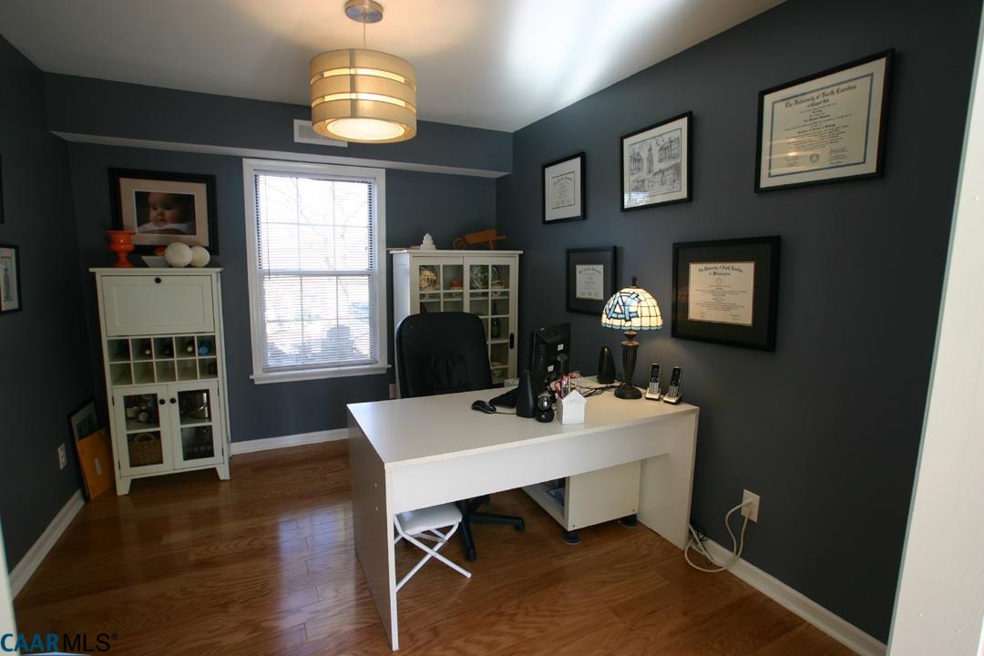 803 Harris Road Charlottesville, VA 22902 - Photo 3 of 15 a workspace with furniture window and wooden floor