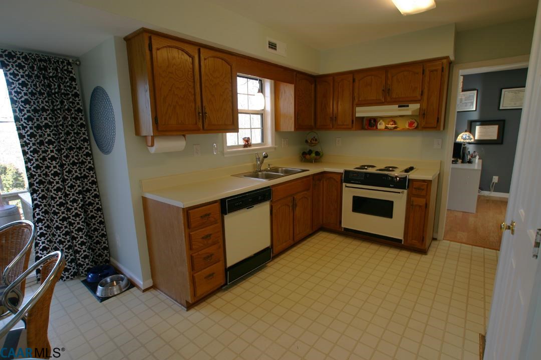 803 Harris Road Charlottesville, VA 22902 - Photo 5 of 15 a kitchen with a stove a sink and a microwave