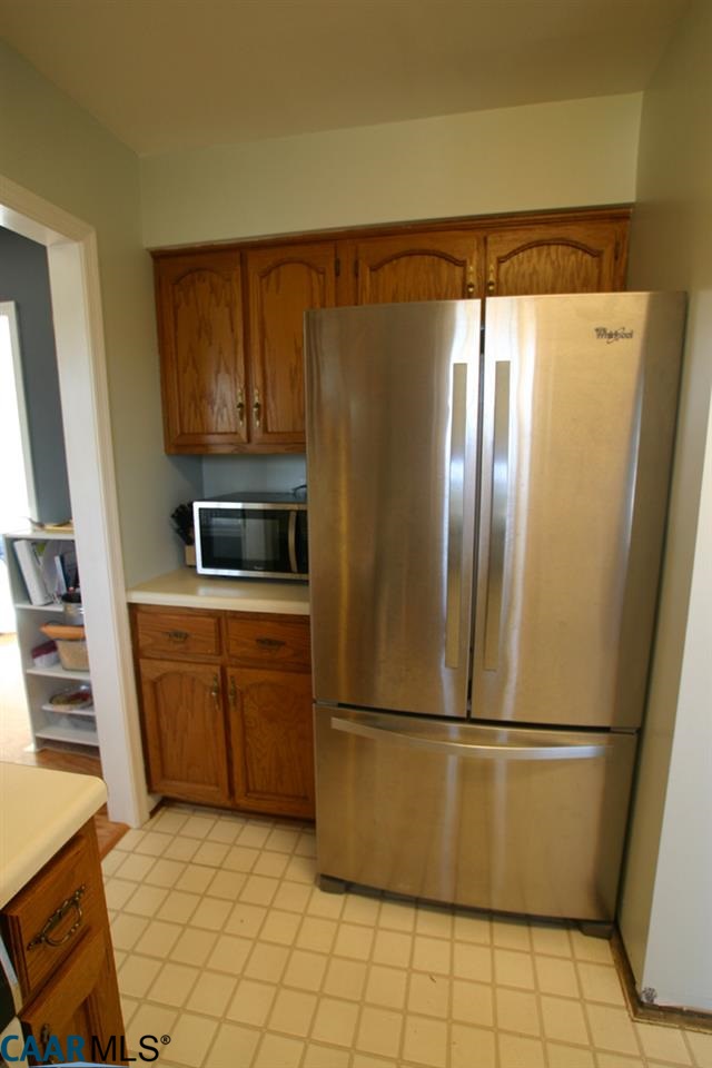 803 Harris Road Charlottesville, VA 22902 - Photo 6 of 15 a kitchen with stainless steel appliances a refrigerator and a stove top oven