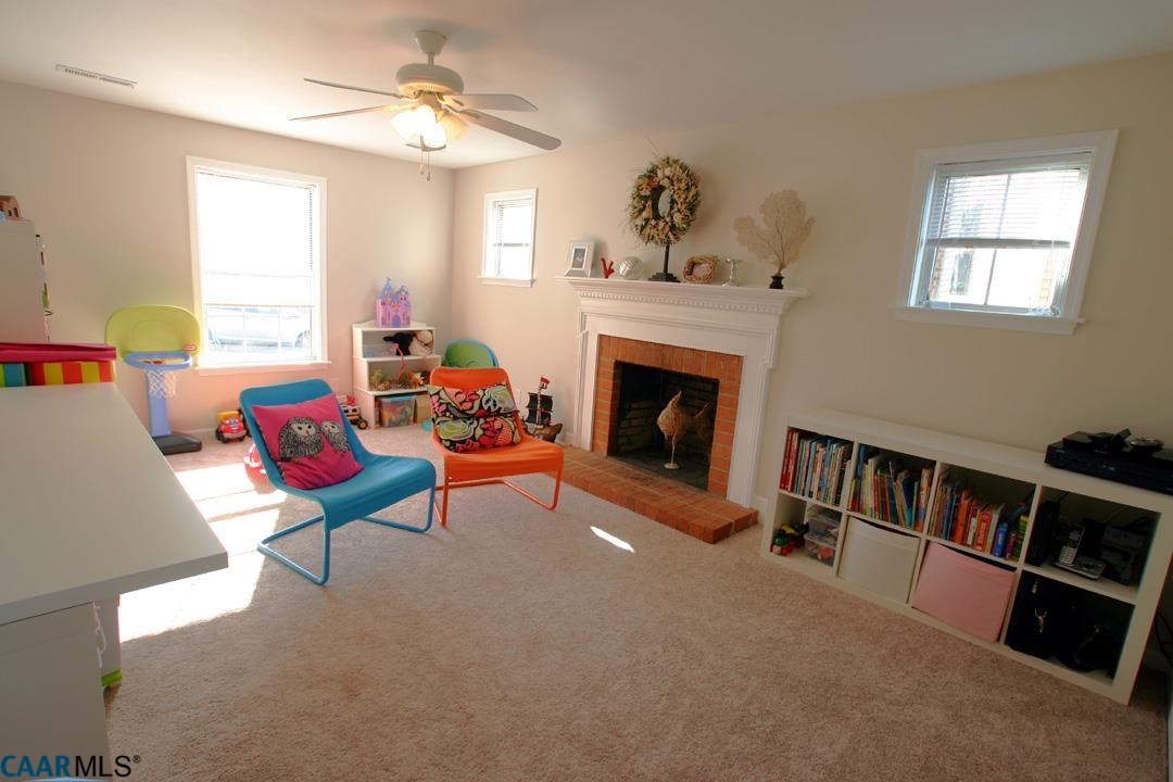803 Harris Road Charlottesville, VA 22902 - Photo 8 of 15 a living room with furniture fireplace and a window