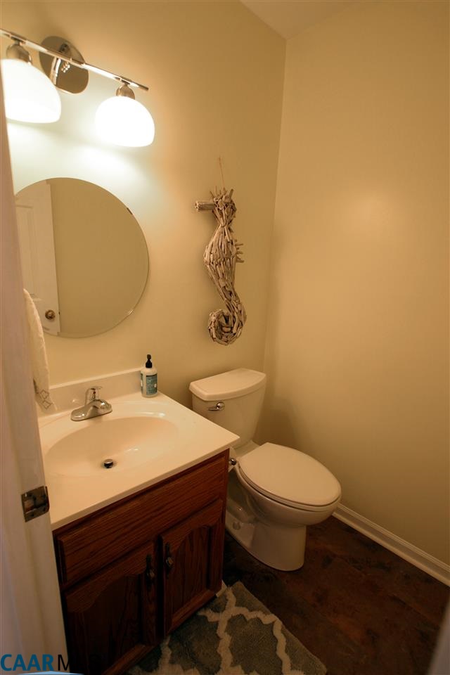 803 Harris Road Charlottesville, VA 22902 - Photo 9 of 15 a bathroom with a sink a toilet and mirror
