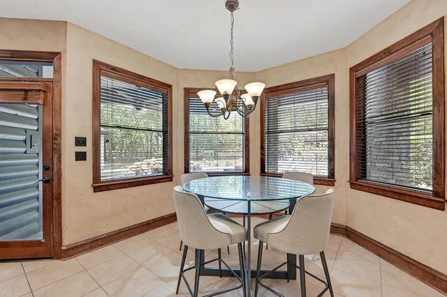 a dining room with furniture and window