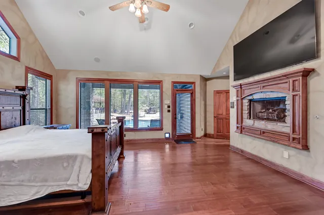 a living room with furniture fireplace and flat screen tv