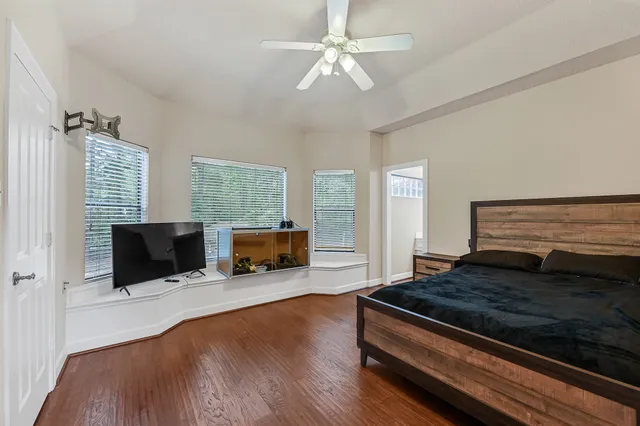 a living room with furniture flat screen tv and a fireplace